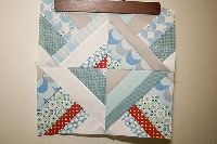 Half square triangle string quilt blocks