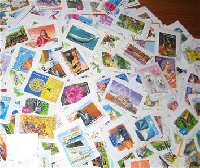 20 used stamps + 1 Touristy Postcard