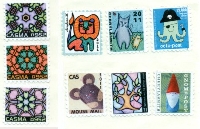 EJ: 5+ Postage Stamps and Postoids on an Envelope
