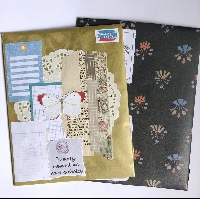 Vintage themed goodies in a decorated folder